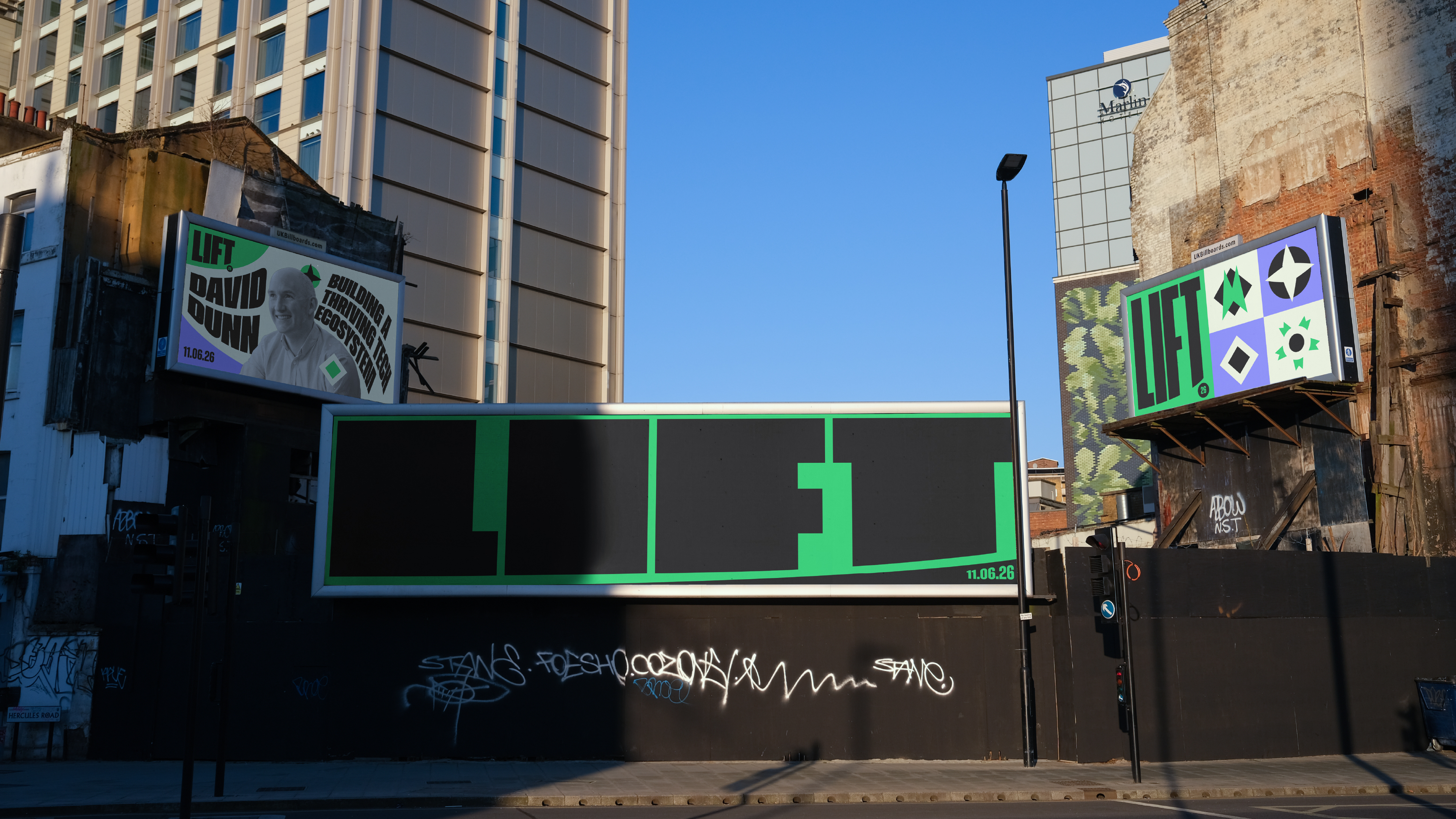Three billboards in a city - all three are advertising the LIFT festival, demonstrating how the logo can adapt and stretch to shape.