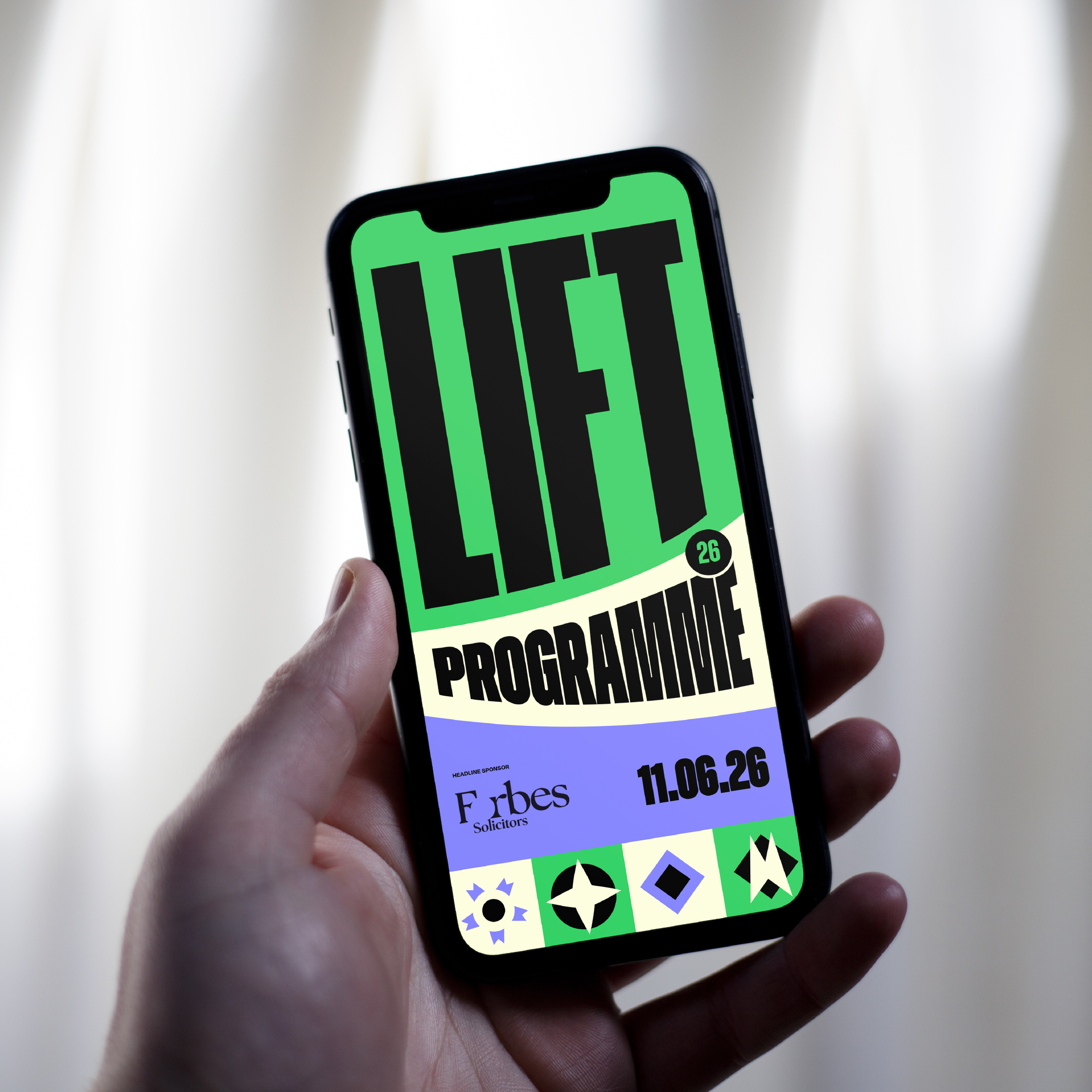 The LIFT digital brochure on a mobile device, held in a hand