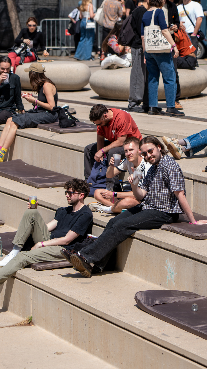 EXP staff/people sat on steps