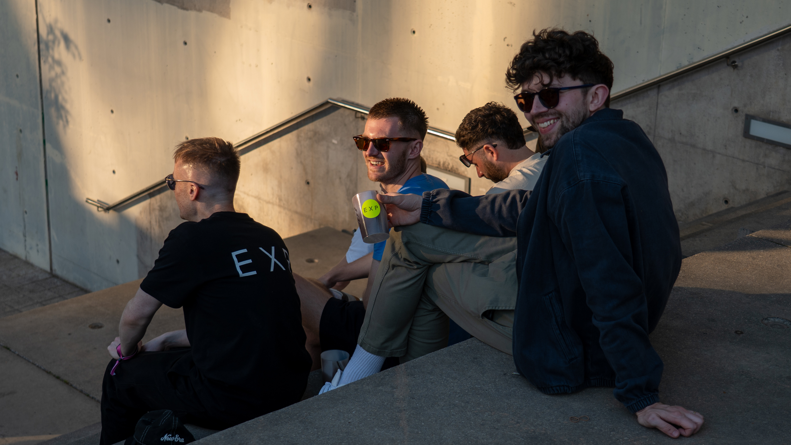 EXP staff/people sat on steps